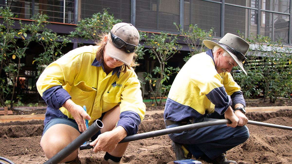 Plant-EM staff installing irrigation at a home in Townsville