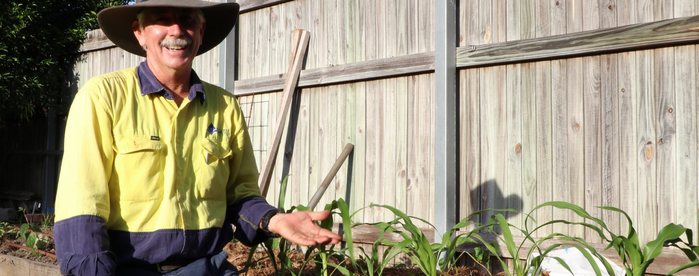 William Crabb from Plant-EM Townsville in front of a DIY Edible garden